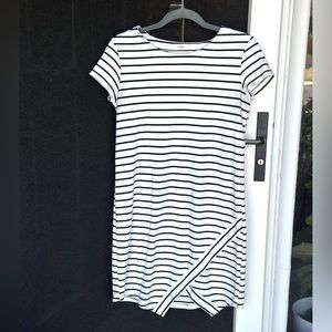 White and black stripped cotton dress with a small thigh slit.